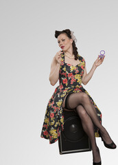 Rockabilly sensuous woman sitting on chair