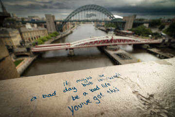 Graffitti message for suicide victims on bridge