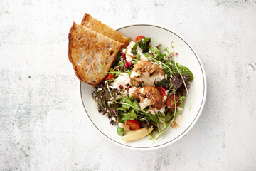 Toast with vegetarian cauliflower salad in bowl