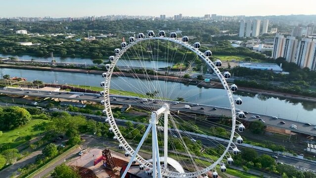 Sao Paulo Brazil. Major Ferris Wheel  Entertainment of Latin America at downtown Sao Paulo Brazil. Ferris wheel at amusement park. Entertainment attraction scenery. Villa Lobos Park. Tourism landmark.