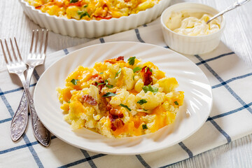 cauliflower bacon cheese casserole on white plate