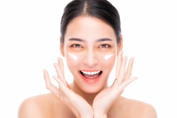 Obraz na płótnie Canvas Close up Beautiful woman applying moisturizer cream to beauty face Happy young asia female has beauty facial skin Attractive girl looks at camera with smile face isolated on white background Skin care