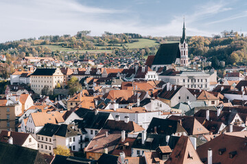 Fototapeta na wymiar Cesky Krumlov, Czech - Nov 21, 2022 : The scenery of buildings in the southern part of the Czech Republic, the harmony of orange roofs and green hills in the distance is like a fairy tail