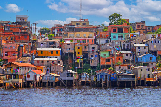 Picture of a housing estate in manaus with colorful houses taken from the Amazon River
