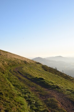 the top of the Malvern hills on a misty day during sunset