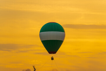 Colorful hot air balloons flying over mountain at Disctrict 2, Ho Chi Minh city in Festival. Beautiful morning, vibrant dawn color