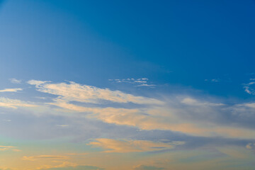 The morning sky looked like a bright golden sky. The sunrise is decorated with clouds in various shapes. Looks beautiful.