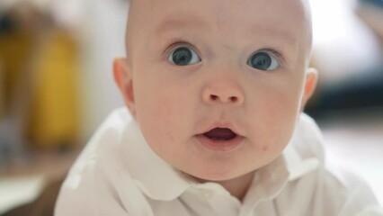 newborn baby a boy portrait close-up. little boy 6 months old looking at the camera 2 baby teeth are visible. happy family kid dream concept. boy smiling newborn lifestyle son