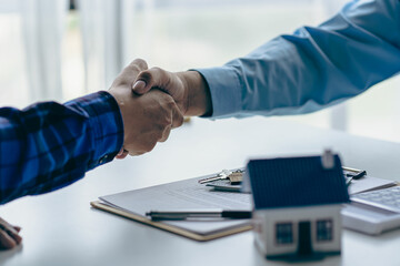 Buyers and real estate agents agree to trade in handshake to rent or buy a home after signing a...