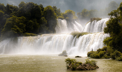 Fototapeta premium Guangxi Detian cross-border waterfall between Vietnam and China. Summmer view, full of water