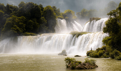 Guangxi Detian cross-border waterfall between Vietnam and China. Summmer view, full of water