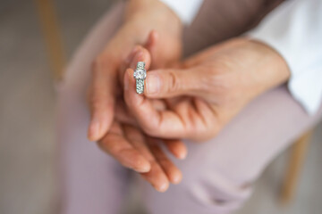 Close up of decisive woman take off wedding ring make decision breaking up with husband, young...