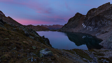 Alpine lake reflections after sunset, blue hour