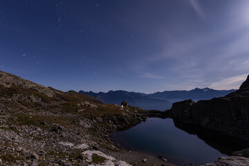 Full moon reflection in the alpine lake