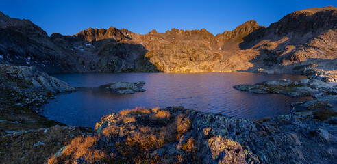 Super colorful surise in the Alpine hut, nearby lake