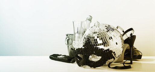 Party time concept. Christmas, New year's eve, Carnival, masquerade. Mask, champagne, party shoes and disco ball