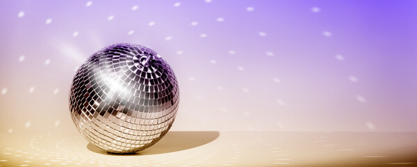 Fototapeta na wymiar Disco ball on vintage styled background. Minimalistic stylish concept.