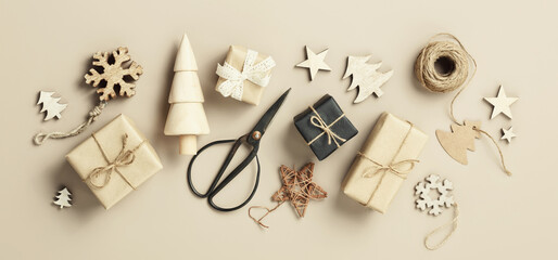 Natural color Christmas gift boxes on beige background, eco friendly trendy zero waste packaging...