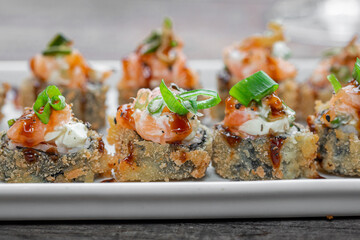 Hot fried Sushi Roll with salmon and cheese. Sushi menu. Japanese food.