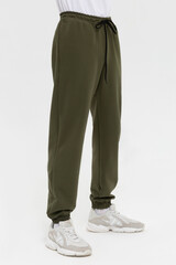 Man in blank green jogger pants mock-up