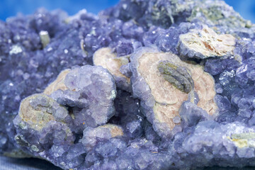 Closeup of naturally occurring rare purple crystalline ore