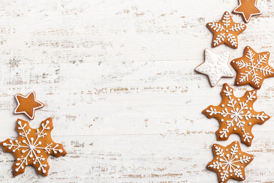 white background with Christmas gingerbread snowflakes icing cookies