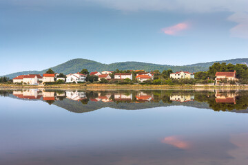 Fototapeta na wymiar Reflection of village of Zablace near Sibenik, Croatia