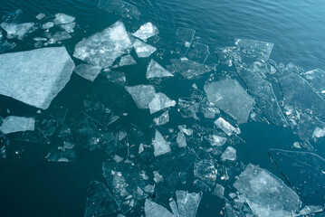 Broken ice in the water. Natural texture