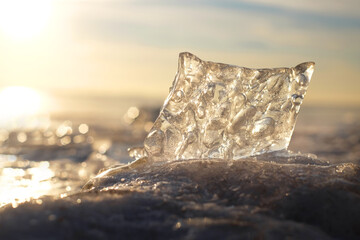 Piece of ice on winter landscape in sunny day