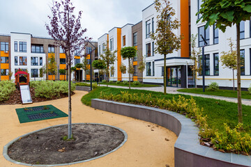 Green recreation area in the courtyard of a multi-storey building