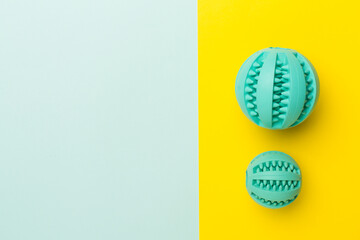 Blue ball toys for dogs on color background