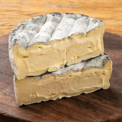 Closeup of cut brazilian artisan Lua Cheia cheese showing creamy interior