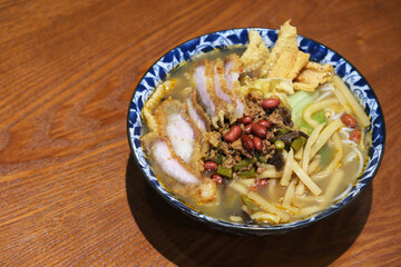 close up a bowl of Snail rice noodle(Luosifen) on table. A Chinese smelly noodle soup of Liuzhou, Guangxi.