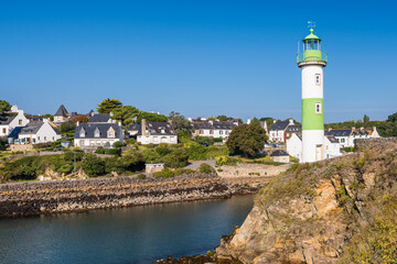 Fototapeta na wymiar Scenic view of lighthouse in Clohars Carnoet in Brittany France during low tide