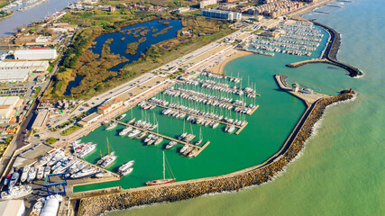 Aerial view on Ostia marina in Rome, Italy. Many boats are parked at the port.