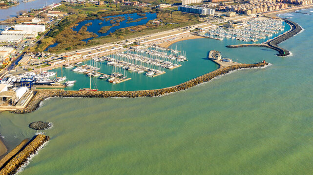 Aerial view on Ostia marina in Rome, Italy. Many boats are parked at the port.