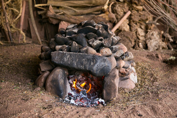 To prepare the Pachamanca ceremony, first you have to prepare an oven with stones that are going to heat up for 4 hours.