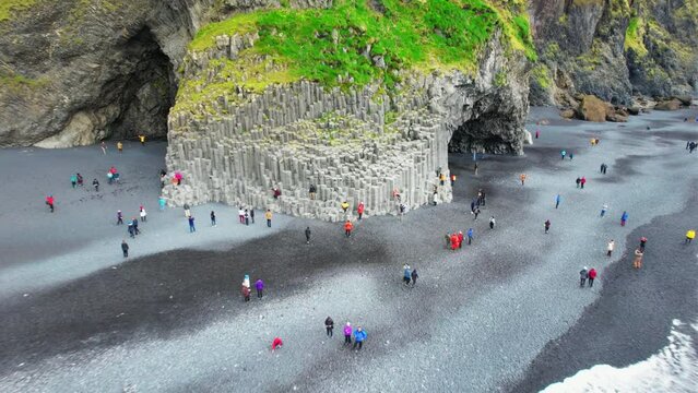 Reynisfjara Black Sand Beach Vik comes with scenic basalt columns and cliffs and is popular tourist destination in Southern Iceland