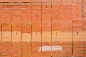 Red brick wall texture with smooth stone blocks. High-quality texture.