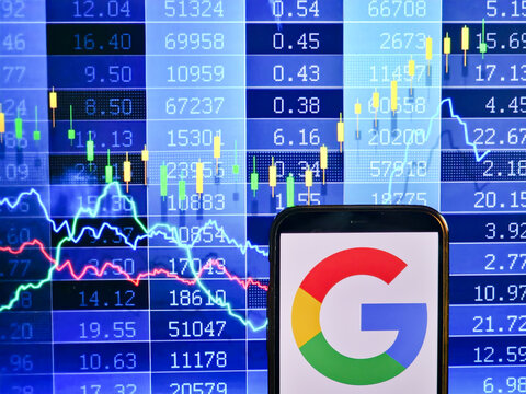 KONSKIE, POLAND - December 12, 2022: Smartphone displaying logo of Google (Alphabet) company on stock exchange chart background