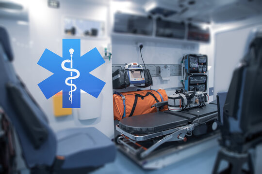 Interior of an ambulance with bed and patient care equipment. Illustration with paramedic logo.