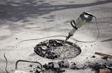 hammer drill in asphalt on site