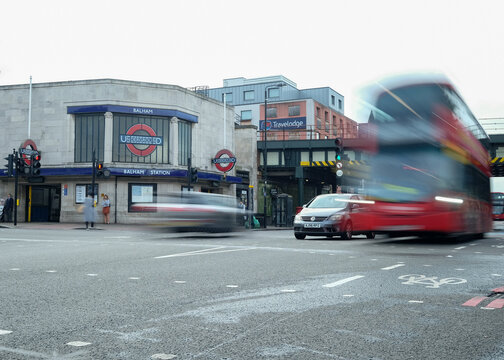London- Balham Station with motion blurred scene from Balham High Street, a residential area of South West London 
