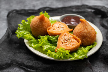 traditional brasilian fried drumsticks Coxinha de frango on dish