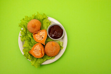 traditional brasilian fried drumsticks Coxinha de frango on dish