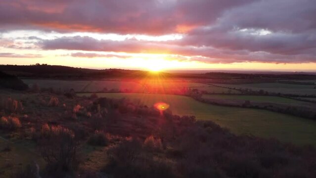4K drone Aerial video establishing shot of countryside in Oxfordshire at sunset