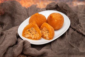 traditional brasilian fried drumsticks Coxinha de frango on dish