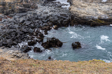 Hiking along the rough coast at Pichilemu, Chile