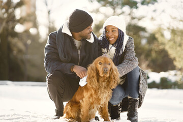 African american couple in a winter forest