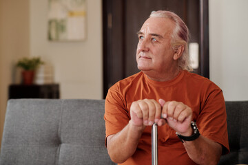 Pensive Aged Man with Walking Stick